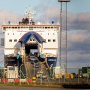 Vehicles drive off a ferry at the Port of Larne in Northern Ireland on Dec. 6, 2020. The port, which handles travel and freight from Scotland, is expected to be building a new Border Control Post (BCP) as a consequence of Brexit. 