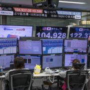 Foreign exchange traders in Tokyo, Japan, monitor screens broadcasting results from the U.S. presidential election on Nov. 4, 2020. Foreign exchange traders in Tokyo, Japan, monitor screens broadcasting results from the U.S. presidential election on Nov. 4, 2020.