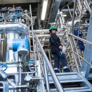 A French biotechnology company is using genetically modified bacteria to produce a gas that is used to make butyl rubber. Biotechnology engineer Jenny Pietzsch walks through a demo plant of the French company Global Bioenergies during its inauguration ceremony in Leuna, Germany, on May 11, 2017.