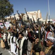 Houthi supporters hold up firearms as they protest the U.S. decision to designate the Houthi movement as a terrorist organization outside the closed American embassy on Jan. 18, 2021, in Sana'a, Yemen. Houthi supporters hold up firearms as they protest the U.S. decision to designate the Houthi movement as a terrorist organization outside the closed American embassy on Jan. 18, 2021, in Sana'a, Yemen.